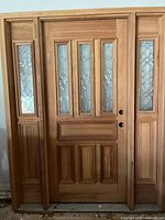 Full view of the wood door with both sidelights installed