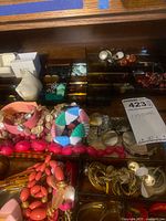Drawer compartments filled with assorted costume jewellery pieces