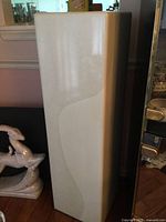 Full view of pedestal front and side showing marble-style pattern