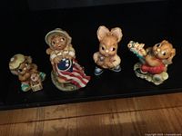 All four Pendelfin rabbit figurines side by side