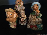 Front view of four rabbit figurines