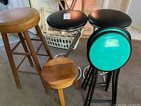 Group shot of all six stools showing materials and colors