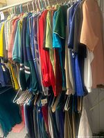 Rack of assorted men’s tops on hangers