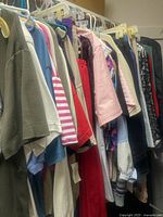 Rail of assorted women’s tops on hangers