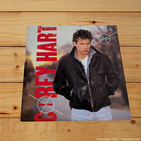 Front cover of Corey Hart's 'Boy in the Box' vinyl LP album showing the artist in a black leather jacket with his name in large red letters.