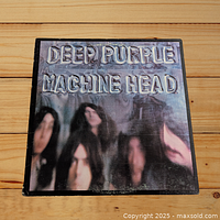 Front cover of Deep Purple 'Machine Head' album showing embossed stylized band photo and text