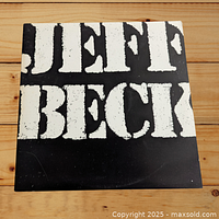 Front cover of Jeff Beck LP "There & Back" with bold white text on black background.