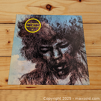 Front cover of Jimi Hendrix The Cry of Love LP showing artistic portrait artwork and album title sticker.