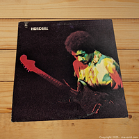 Front cover of the Band of Gypsys album featuring Jimi Hendrix playing guitar.