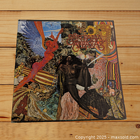 Front cover of Santana Abraxas LP showing vivid psychedelic artwork with mythical figures.