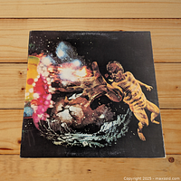 Front cover of Santana III vinyl record album showing vibrant cosmic artwork with abstract human figure and colorful lights against a dark space background.