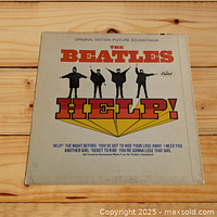 Front cover of The Beatles HELP! soundtrack album showing the band members and album title.