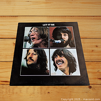Front cover of The Beatles LP Let It Be showing faces of the four band members in a 2x2 grid.