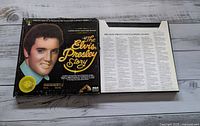 Box set cover with Elvis Presley portrait and booklet inside.