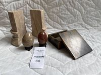 Full set view showing all pieces on quilted background; two bookends, two stone eggs, and trinket box with lid.