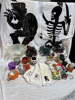 Alternate angle close-up of Halloween light strands, mugs, and treat boxes showing more detail of Halloween-themed graphics and designs.