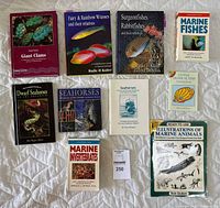 Complete collection of 10 marine life reference books with covers showing various marine animals including fishes, clams, seahorses, and invertebrates arranged on a white surface.