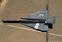 Side view of galvanized steel Danforth boat anchor showing fluke design and crossbar.