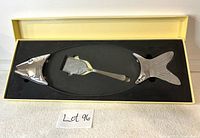 Photo of fish shaped seafood serving platter made of glass with silver plated fish head and tail ends, along with matching silver spatula with fish motif in original box.