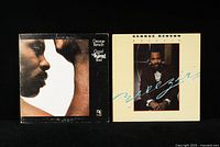 Two George Benson jazz vinyl LP records side by side: Good King Bad and Breezin album covers.