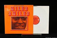 Front cover of the Miles Davis Quintet 'Miles Smiles' vinyl LP showing the orange cover with the photo of Miles Davis and the album title.