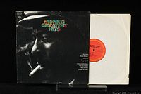 Front cover of Thelonious Monk Greatest Hits LP showing profile photo with colorful title text.