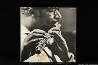 Front cover of Yusef Lateef's The Dreamer LP showing detailed black and white photo of artist playing flute.
