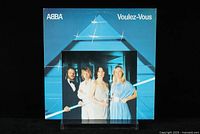 Front cover of ABBA Voulez-Vous album showing the band members and blue geometric design.