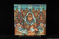 Front cover of Blue Oyster Cult Fire of Unknown Origin LP with robed figures and mystical theme artwork.