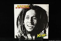 Front cover of the Bob Marley & The Wailers 'Kaya' LP showing black and white photo of Bob Marley with colorful album title.