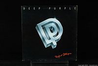 Front cover of DEEP PURPLE - Perfect Strangers vinyl record LP showing the silver 'DP' logo on black background with red text.