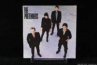 Front album cover of The Pretenders - Learning to Crawl featuring band members on a light background, verifying album image and condition.