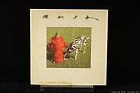 Front cover of Rush 'Signals' LP featuring dog and fire hydrant image, some wear and a stain on the bottom edge