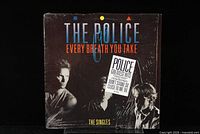 Front cover of the vinyl LP 'Every Breath You Take, The Singles' by The Police, sealed with shrink wrap and a sticker.