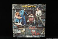 Front cover of The Who's 'Who Are You' vinyl LP showing band members and industrial setting.