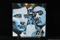 Front cover of the vinyl album showing the unique surreal artwork of three men with bead-covered faces and a woman standing behind.