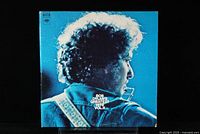 Front cover of Bob Dylan Greatest Hits Vol. II blue gatefold featuring Bob Dylan in profile.