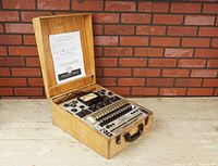 Wooden case open showing entire tester including front panel, meter and tube sockets