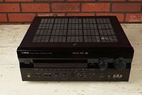 Front view showing power button, display and row of control knobs