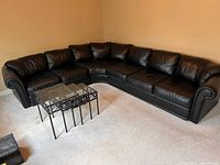 Full view of L-shaped sectional sofa in corner of room