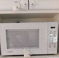 Front view of white Vissani microwave oven with digital control panel and viewing window.