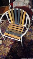 Vintage tubular metal lawn chair with multicolored slats, white frame; photo to show chair condition and style