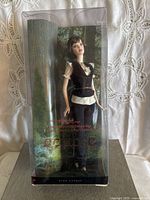 Front view of Alice Twilight Saga collector doll in sealed packaging showing doll and background forest design.