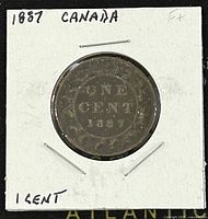 Reverse side of the 1887 Canadian Queen Victoria Large One Cent showing denomination and date within a wreath design.