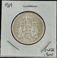 Reverse side of Canadian 1964 50 cents coin showing Canadian coat of arms with '50 CENTS' and the date 1964.
