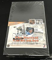 Factory sealed rectangular box of 1991 NHL Pro Set 75th Anniversary hockey cards showing front with NHL Pro Set logo, player image, and promotional text.