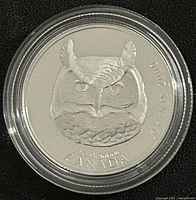 Reverse of the coin showing the detailed Horned Owl design, denomination 50 cents, year 2000, and Canada inscription.