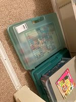 Three translucent green storage bins with assorted LEGO bricks and base plates