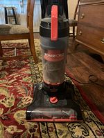 Midsection showing PowerForce logo and dirt canister