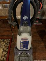 Front view showing Dirt Devil branding and handle